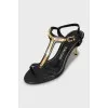 Leather sandals with golden heels