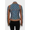 Denim jacket with leather inserts