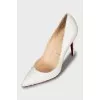 White snakeskin shoes