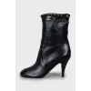 Ankle boots decorated with chain on a stiletto heel