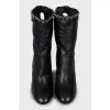 Ankle boots decorated with chain on a stiletto heel