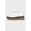 White shoes with twist buckle