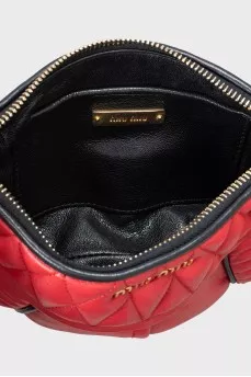 Quilted clutch with gold hardware