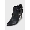 Leather ankle boots decorated with spikes
