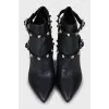Leather ankle boots decorated with spikes