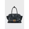 Black tote bag with gold hardware