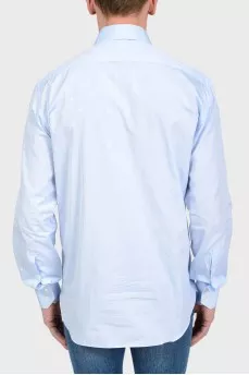 Blue shirt in print with a logo