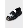 Black and white tassel loafers