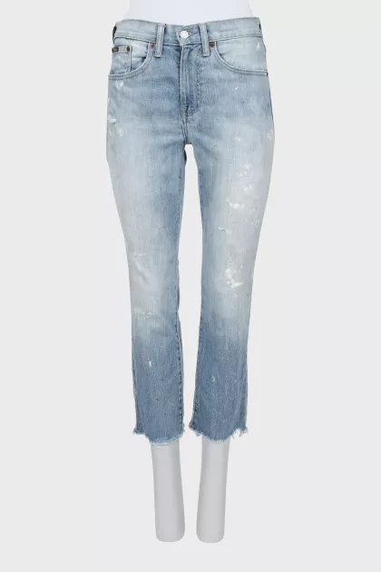 Light blue jeans with raw hem