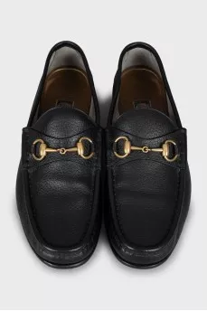 Leather loafers with gold decor