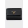 Leather wallet with gold logo and tag