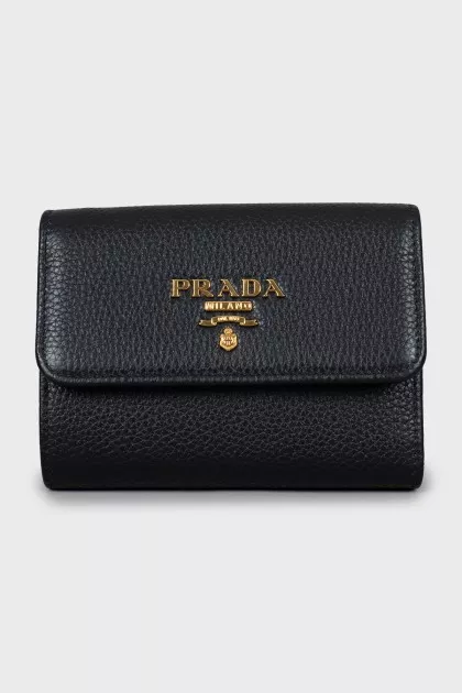 Leather wallet with gold logo and tag