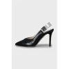 Black slingbacks with embossed leather