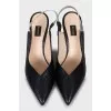 Black slingbacks with embossed leather