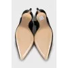 Black slingbacks with embossed leather