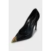 Patent leather shoes with gold decor