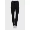 Black jeans with raw hem
