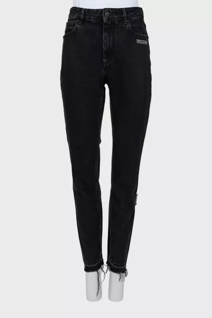 Black jeans with raw hem