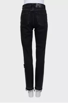 Black jeans with raw hem