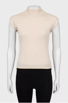 Knitted vest with a high neck