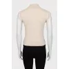 Knitted vest with a high neck