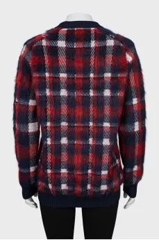 Long pile sweater with tag