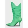 Leather boots with stiletto heels and pointed toe