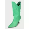 Leather boots with stiletto heels and pointed toe