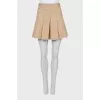 Pleated skirt with tag