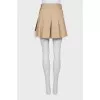 Pleated skirt with tag