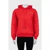 Red hoodie with print on sleeves