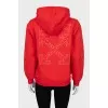 Red hoodie with print on sleeves