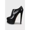 Black leather lace-up ankle boots