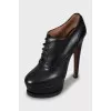 Black leather lace-up ankle boots