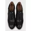 Black leather lace-up ankle boots