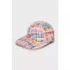 Woven cap in a combination of colors