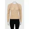 Beige sweater with a pattern