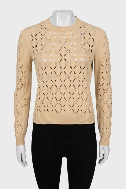 Beige sweater with a pattern