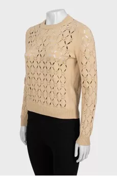 Beige sweater with a pattern