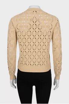 Beige sweater with a pattern