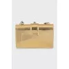 Golden bag decorated with rhinestones