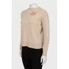 Wool sweater with embroidered print