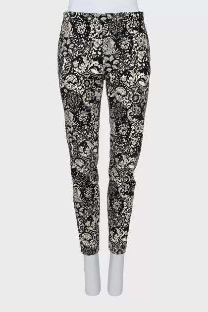 Trousers with stitched creases in a print