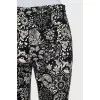 Trousers with stitched creases in a print