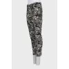 Trousers with stitched creases in a print
