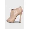 Beige ankle boots with perforation