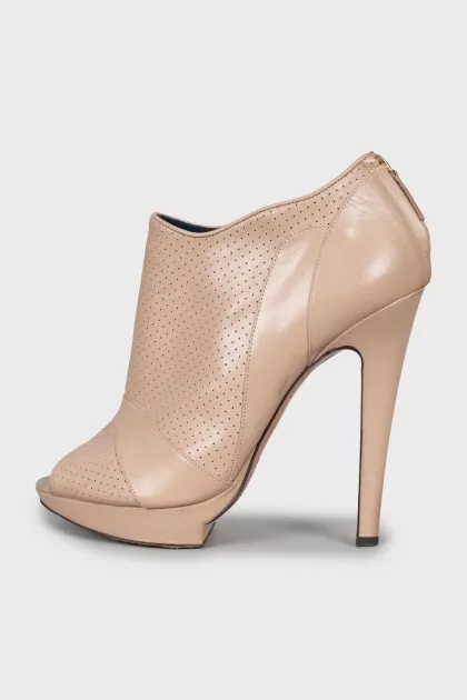 Beige ankle boots with perforation