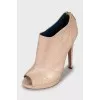 Beige ankle boots with perforation