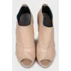 Beige ankle boots with perforation