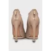 Beige ankle boots with perforation